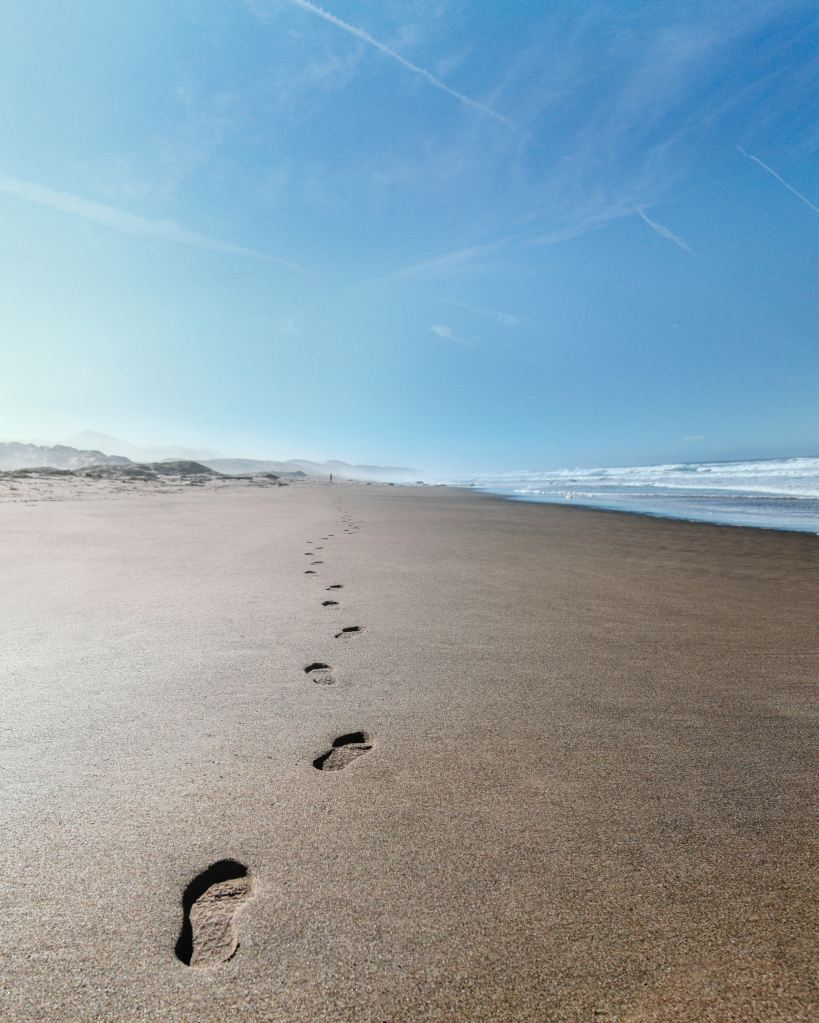 footprints-on-beach-sand-for=path