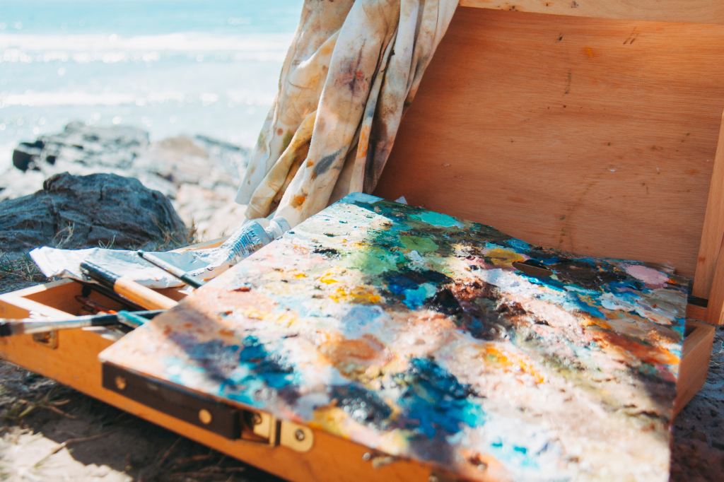 painting-and-supplies-on-beach