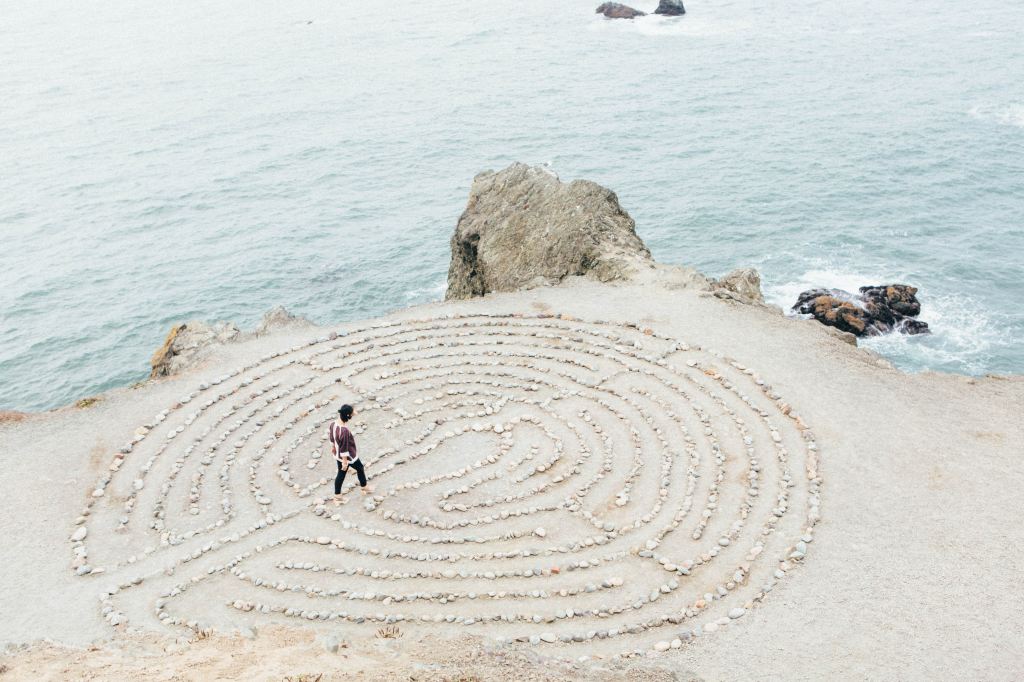 meditative-maze-on-beach-with-person
