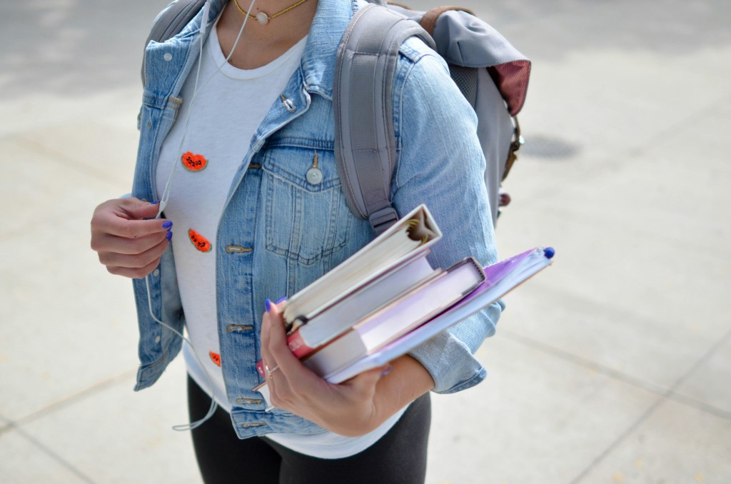 college-student-with-books-and-backpack